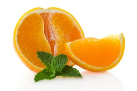Orange fruit segment and mint leaf Stock Photos