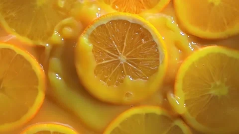 Orange fruit slice macro in slow motion. Healthy food. Natural background 動画素材 183382461