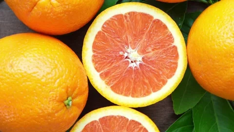 Orange fruit with slices closeup, Top view Rotate fruits. Stock Footage 235388682