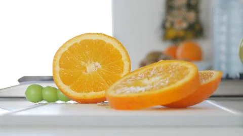 Orange Fruit Slices on the Kitchen Table, Sweet and Healthy Tropical Fruit 스톡 사진