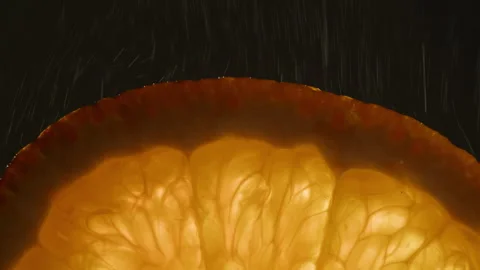 Orange fruit with water close-up macro. Slice of fresh exotic orange fruit Stock Footage 264937717