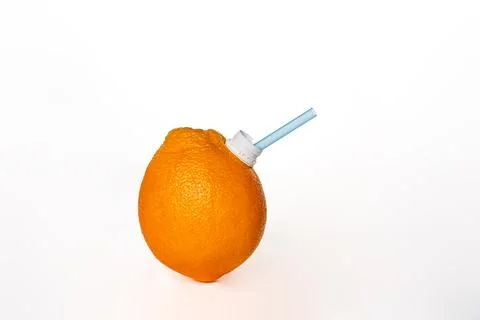 Orange, fruit on a white background, with a straw in the spout to be able t.. Stock Photos