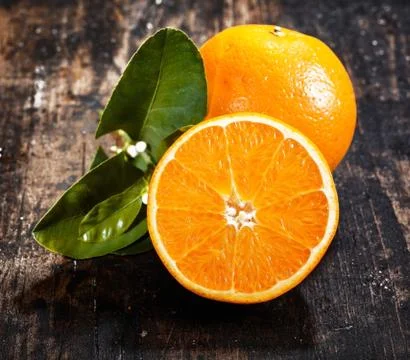 Orange fruit on wood Stock Photos
