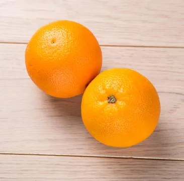 Orange fruits on wooden table background Stock Photos