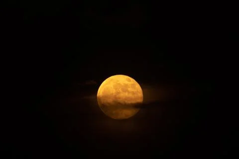 Orange full moon on black night sky. Blood moon. Flower moon. Lunar eclipse.  Stock Photos