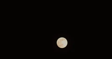 Orange full moon real time moonlight Stock Footage