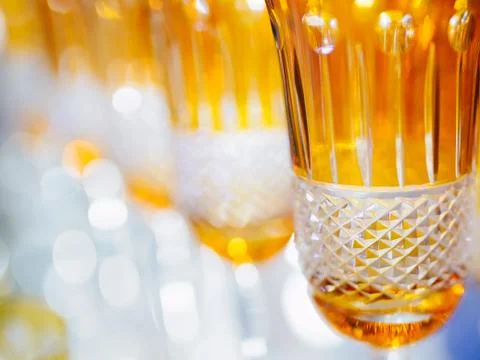 Orange glasses in a row - texture with light behind Foto stock