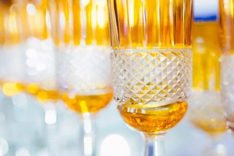 Orange glasses in a row - texture with light behind Stock Photos