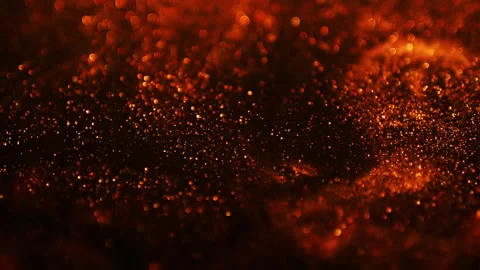 Orange glitter background in slow motion. Orange particles on black background Stock Footage 168277945