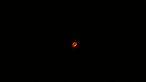Orange glowing ball on a black background. Stock Footage 104568816