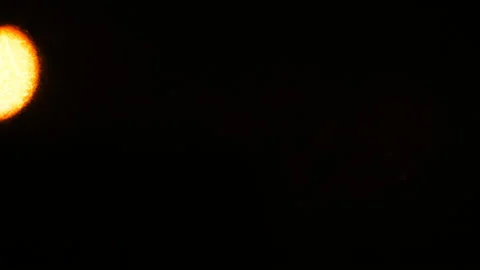 Orange glowing ball on a black background. Stock Footage 104568848