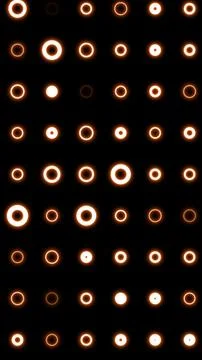 Orange glowing ring lights on black in a clean grid, a minimal geometric pa.. 스톡 일러스트