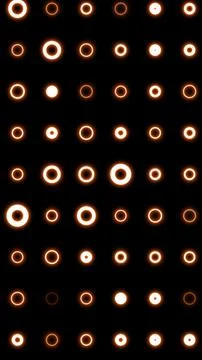 Orange glowing ring lights on black in a clean grid, a minimal geometric pa.. 스톡 일러스트