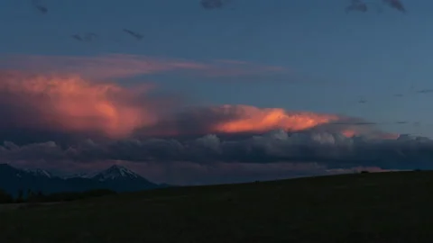 Orange glowing sunset clouds over mountain valley Stock Footage 167109619