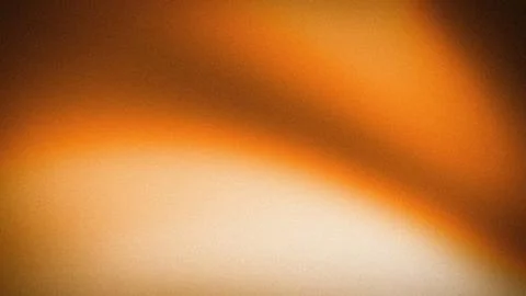 Orange grainy blurred abstract gradient wallpaper background with warm brow.. 스톡 사진