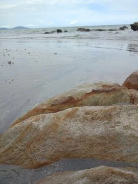 Orange granite on the beach Stock Photos