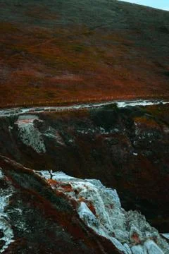 An orange grassy cliff side Stock Photos