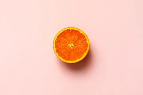 Orange half fruit sliced isolate on pink background Stock Photos