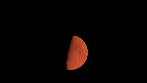 Orange Half Moon Timelapse across sky, night Video stock 244956249