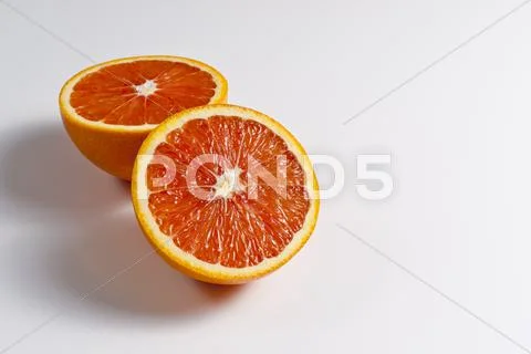 An orange, halved Stock Photos