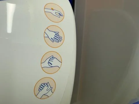 Orange hand cream application steps dispenser detail Stock-Fotos