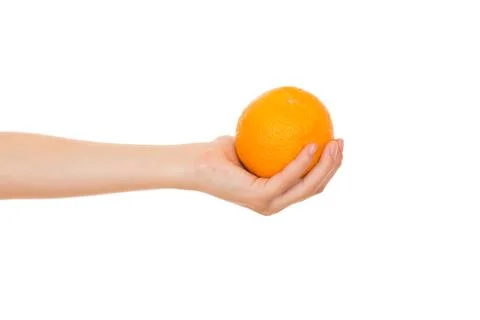 Orange in a hand Stock Photos