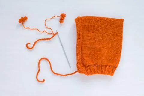 Orange handmade hat on white background Stock Photos