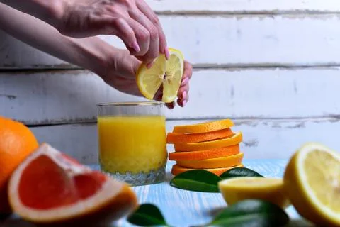 The orange in the hands Stock Photos