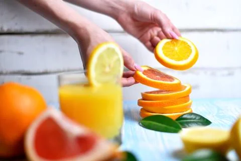 The orange in the hands Stock Photos