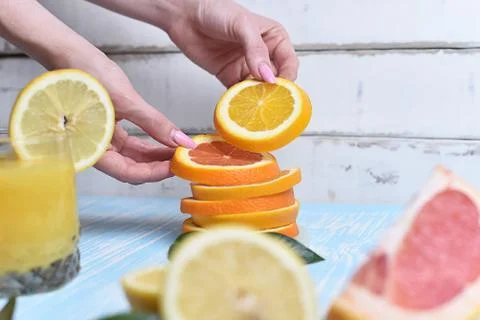 The orange in the hands Stock Photos