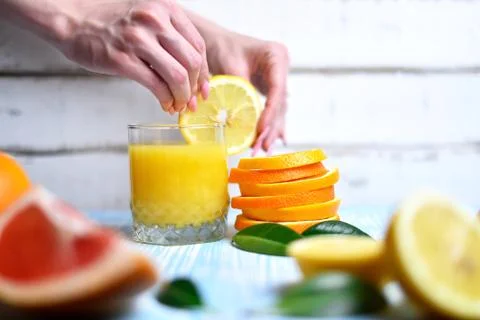 The orange in the hands Stock Photos