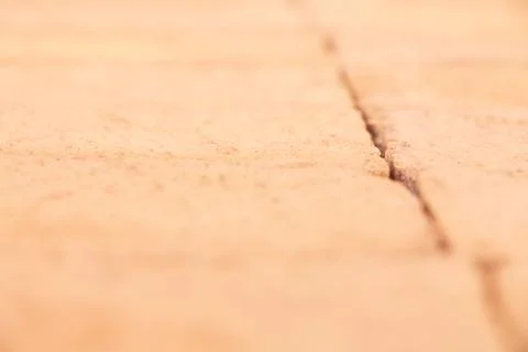 Orange harsh texture brick wall with spot focus in a big close up detail Fotos Stock