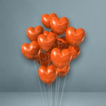 Orange heart shape balloons bunch on a grey wall background Illustrazione stock
