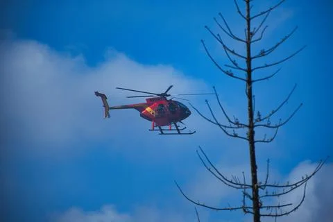 Orange Helicopter in Flight 写真素材