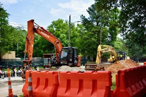 Orange Hitachi at work Stock Photos