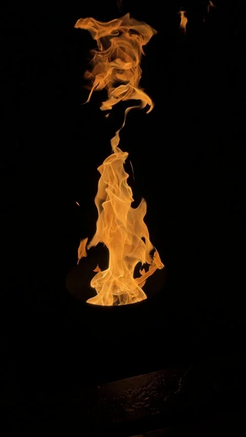 Orange hot fire flames gun isolated on black background. Stock Footage 311570947