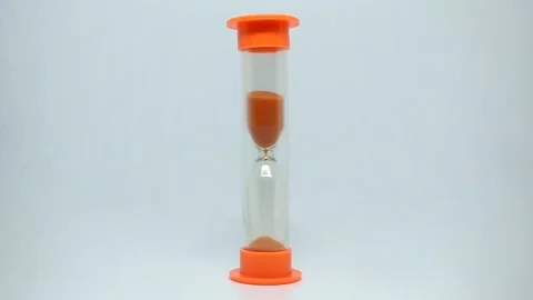 Orange hourglass on a white background. Timelapse Stock Footage 175370033