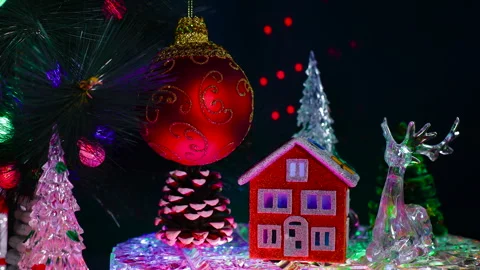 An orange house with a deer and a pine cone near a red ball Stock Footage 322049117