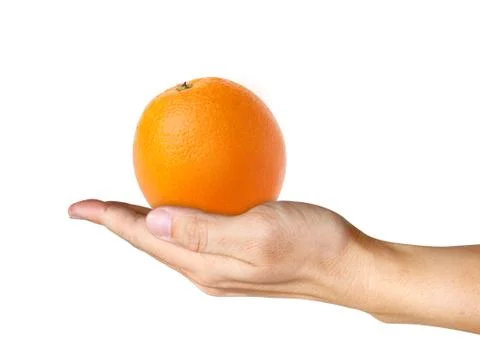 Orange on human hand Stock Photos