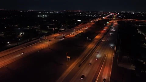 Orange illuminated interstate highway in Florida with busy traffic at night Stock-Footage 313025931