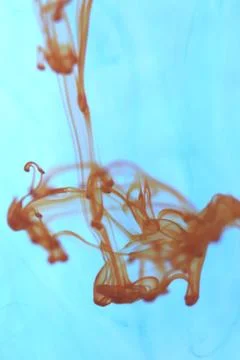 Orange Ink Drop Dynamic Motion. Ambient Background. Stock Photos