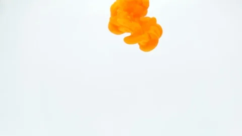 Orange ink in water.Creative slow motion. On a white background Stock Footage 101279433