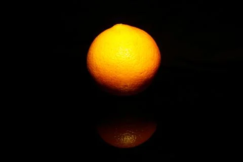 Orange isolate on black background Foto stock