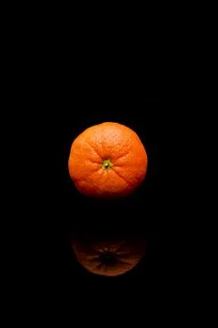 Orange isolated on black background Stock Photos
