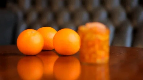 Orange jam and oranges on the table. Video stock 72635043