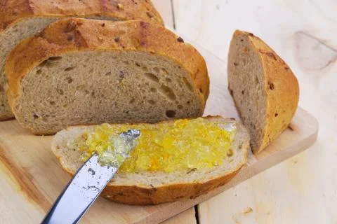 Orange jam and wholegrain bread Stock Photos