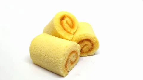 Orange Jam Roll isolated on the white background. Stock Photos