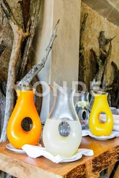 Orange juice and lemonade n a unique decanter at a safari lodge in Kruger Nat Stock Photos