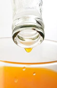 Orange juice drop Stock Photos