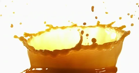 Orange Juice exploding against White Background, Slow Motion 4K Video stock 75972963